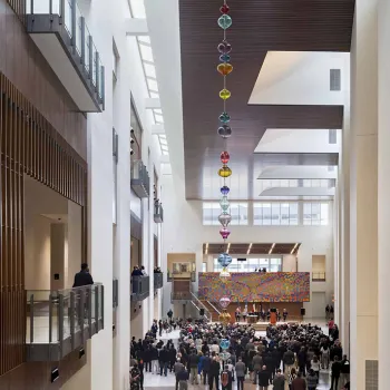 A glass art installation hangs inside the new federal courthouse in San Antonio.